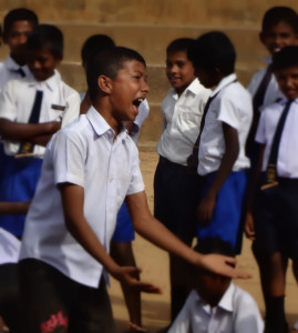 Young actor performing during the street drama.