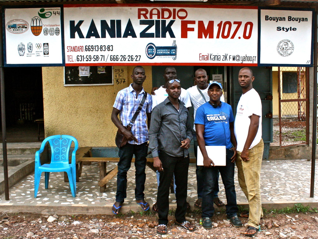 KaniaZik FM’s team proudly posing in front of their radio station in Kindia, Guinea.