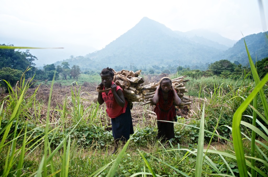 Two young girls from Lukweti carry firewood home. Lukweti is the village where the armed group APCLS set up their HQ several years ago. Lukweti, North Kivu, August 2013.